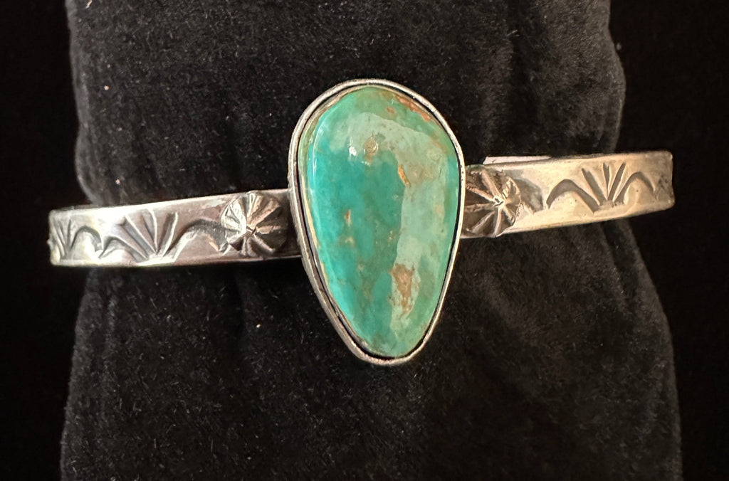 Navajo sterling silver teardrop turquoise cuff bracelet with star shot detailing – top view | Rockin' M Leathers