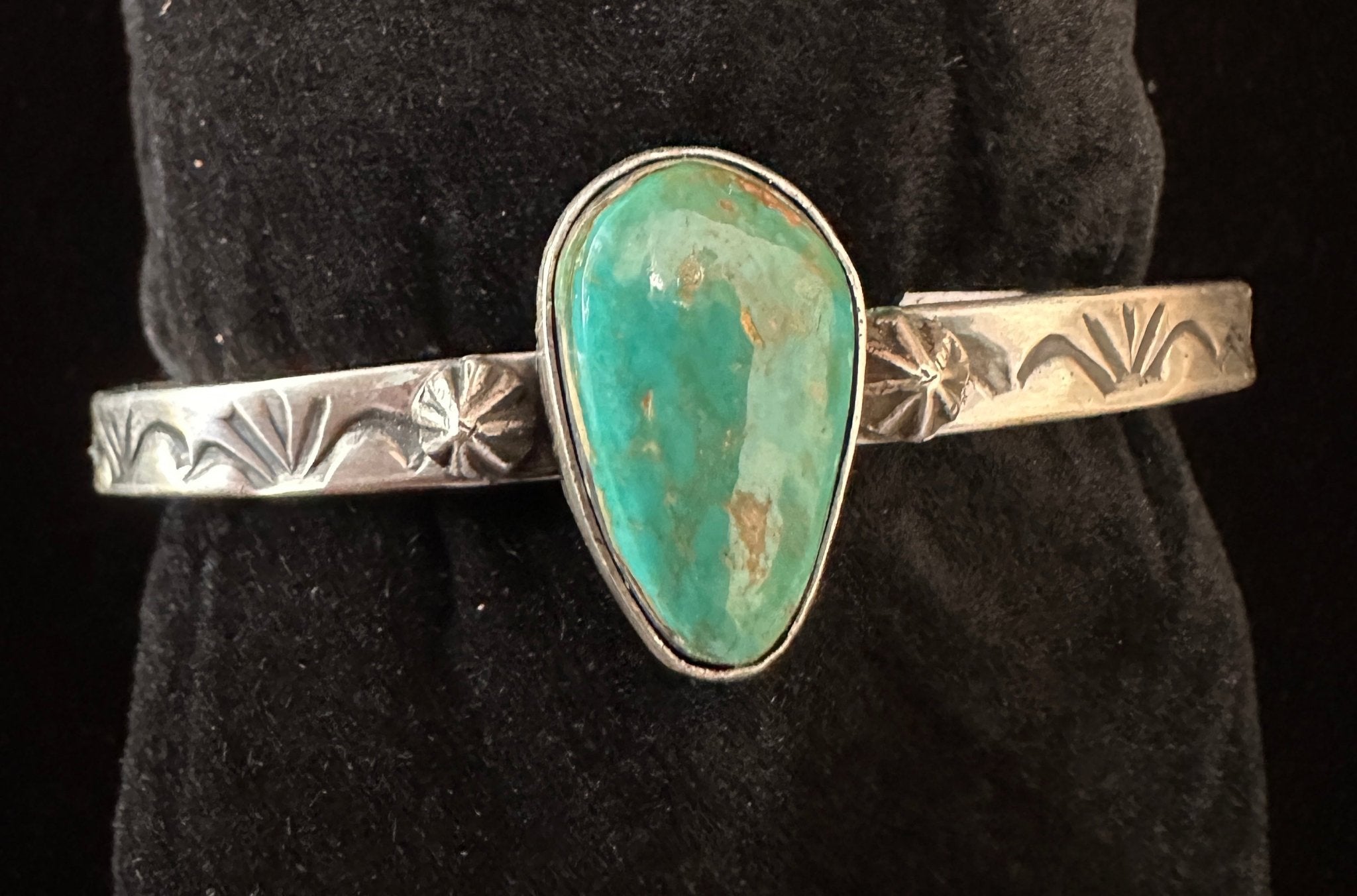 Navajo sterling silver teardrop turquoise cuff bracelet with star shot detailing – top view | Rockin' M Leathers