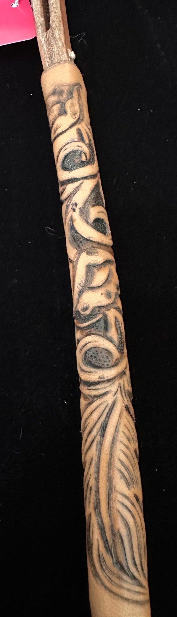 Hand tooled leather over-under whip – close-up partial handle view with flower pattern | Rockin' M Leathers
