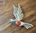 Navajo sterling silver hummingbird pin and pendant by "LC" — wings spread in flight with coral center stone, intricate hand-worked detail