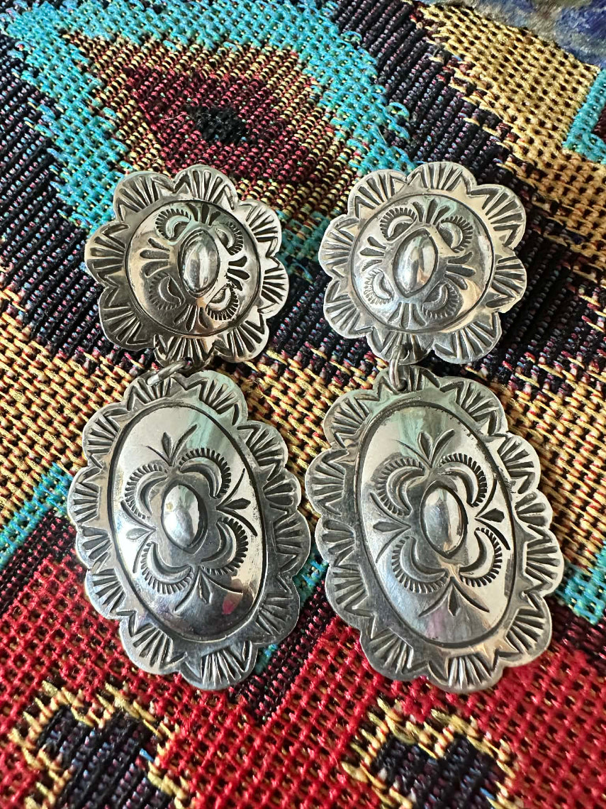High Shine Sterling Silver Double Concho Post Dangle Earrings by Navajo artist Bertha Begay - flat lay 